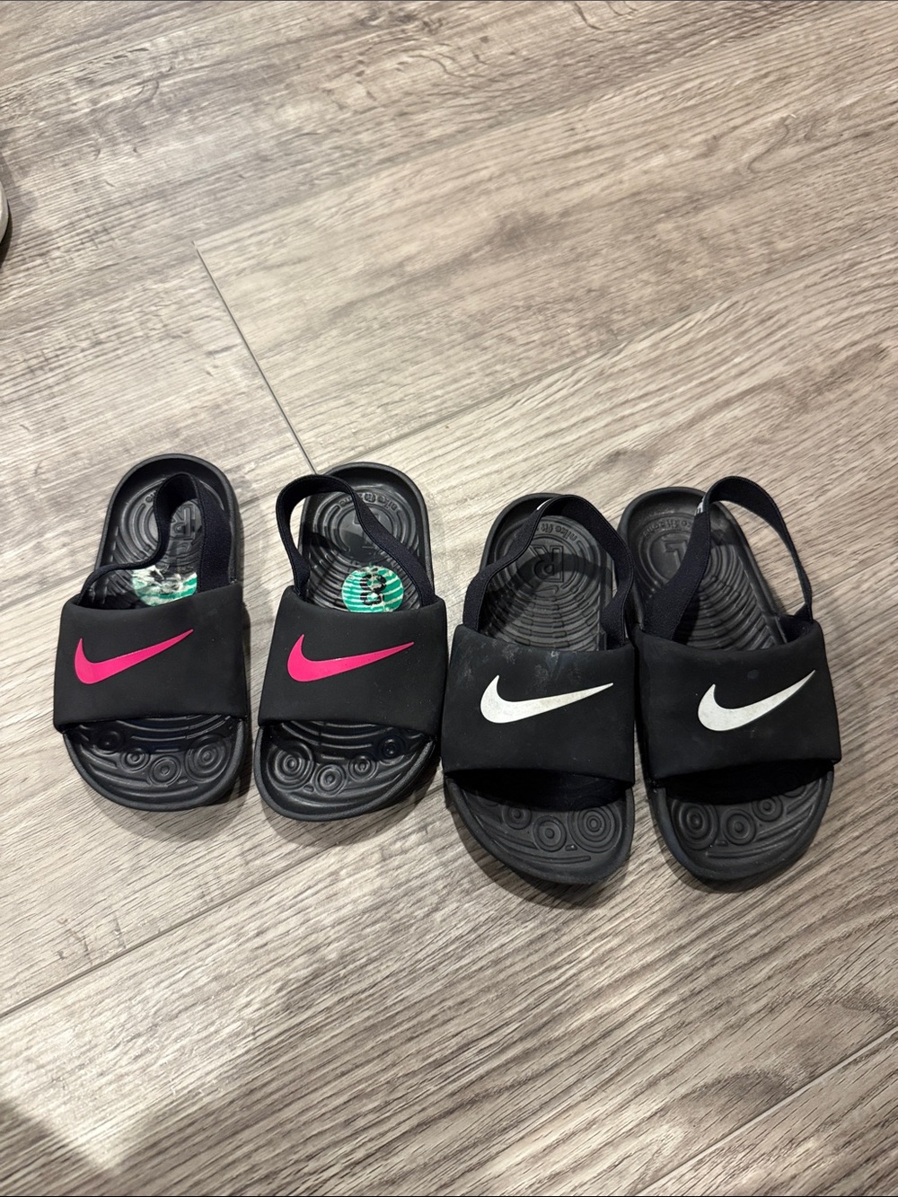 Nike Kids Black Slide Sandals with Pink and White Swoosh